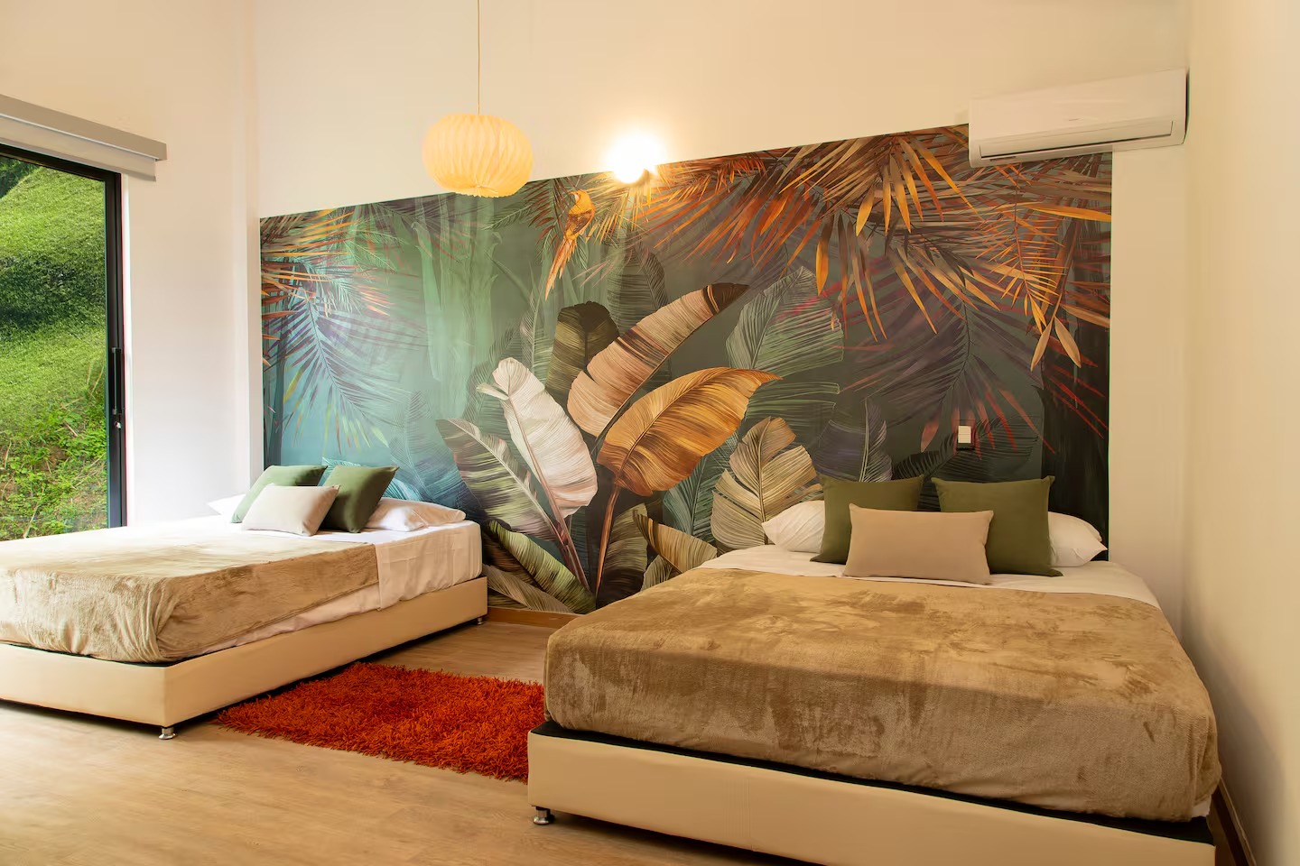 Tropical-themed bedroom with jungle mural