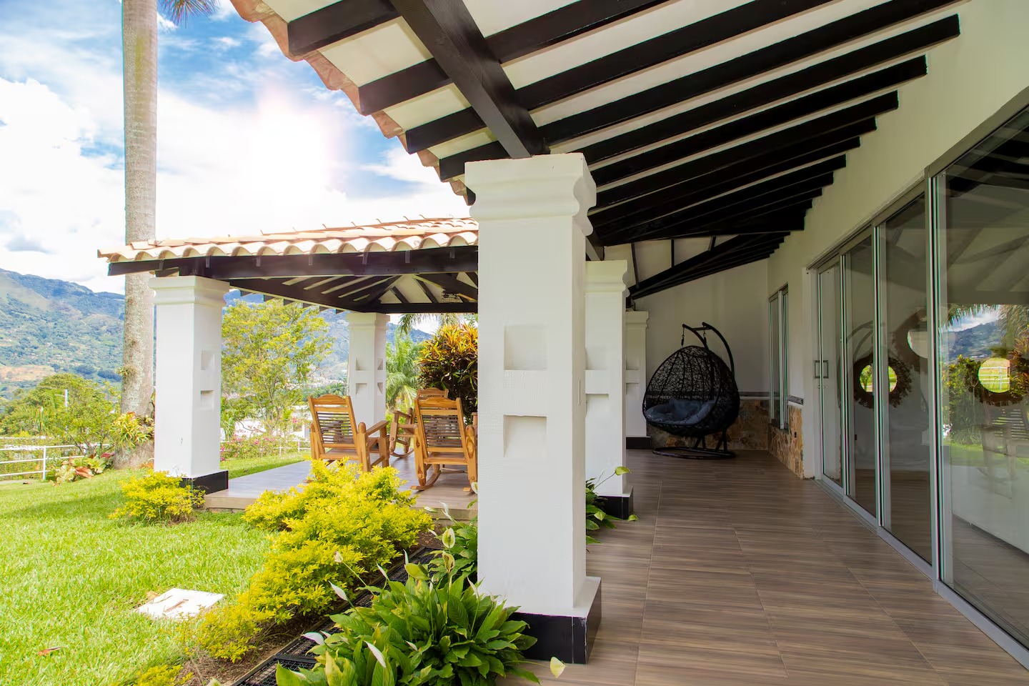 Covered terrace and common area with mountain views